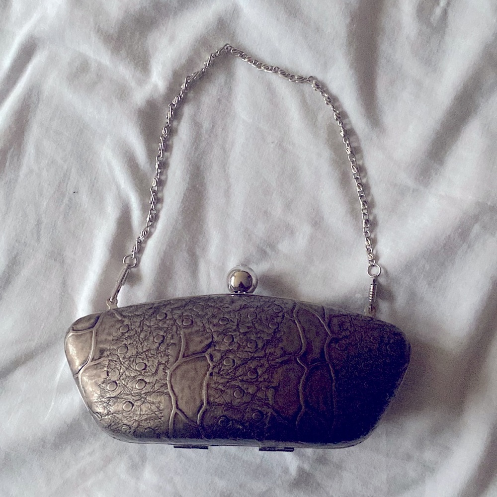 Retro style clutch hand bag. Solid material